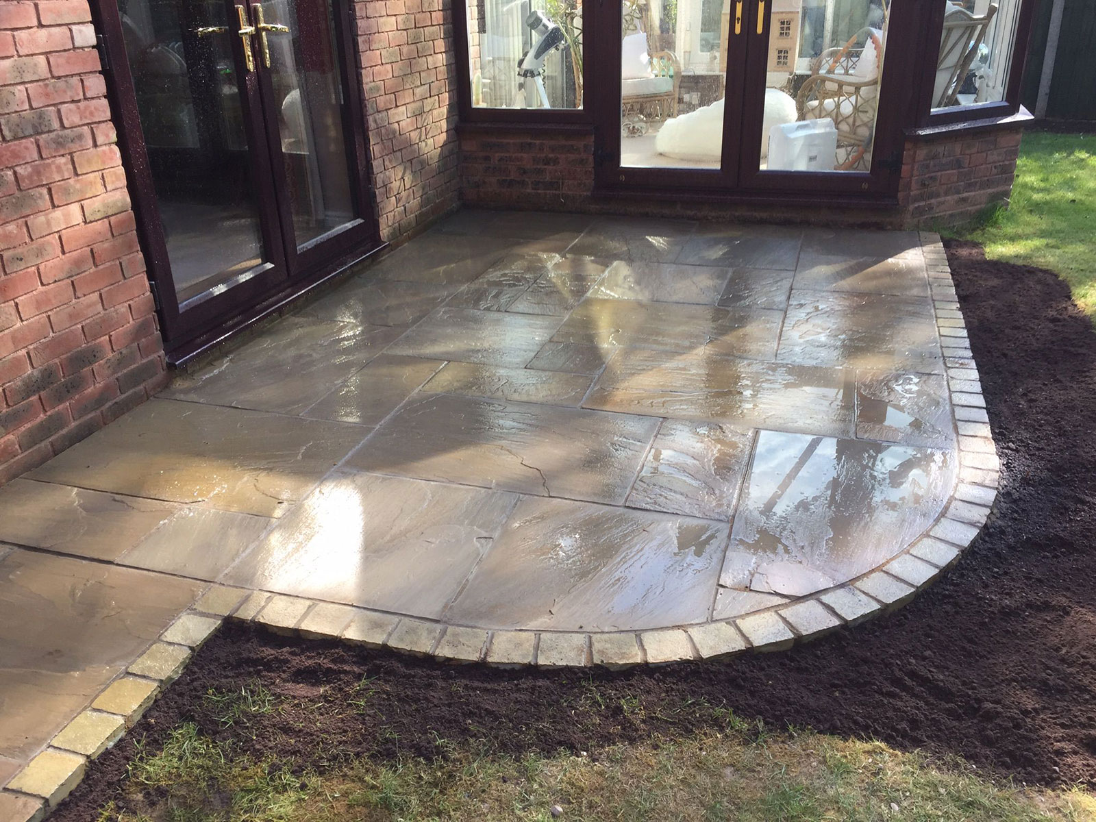 Sandstone patio by Stone Landscapes, Woking, Surrey