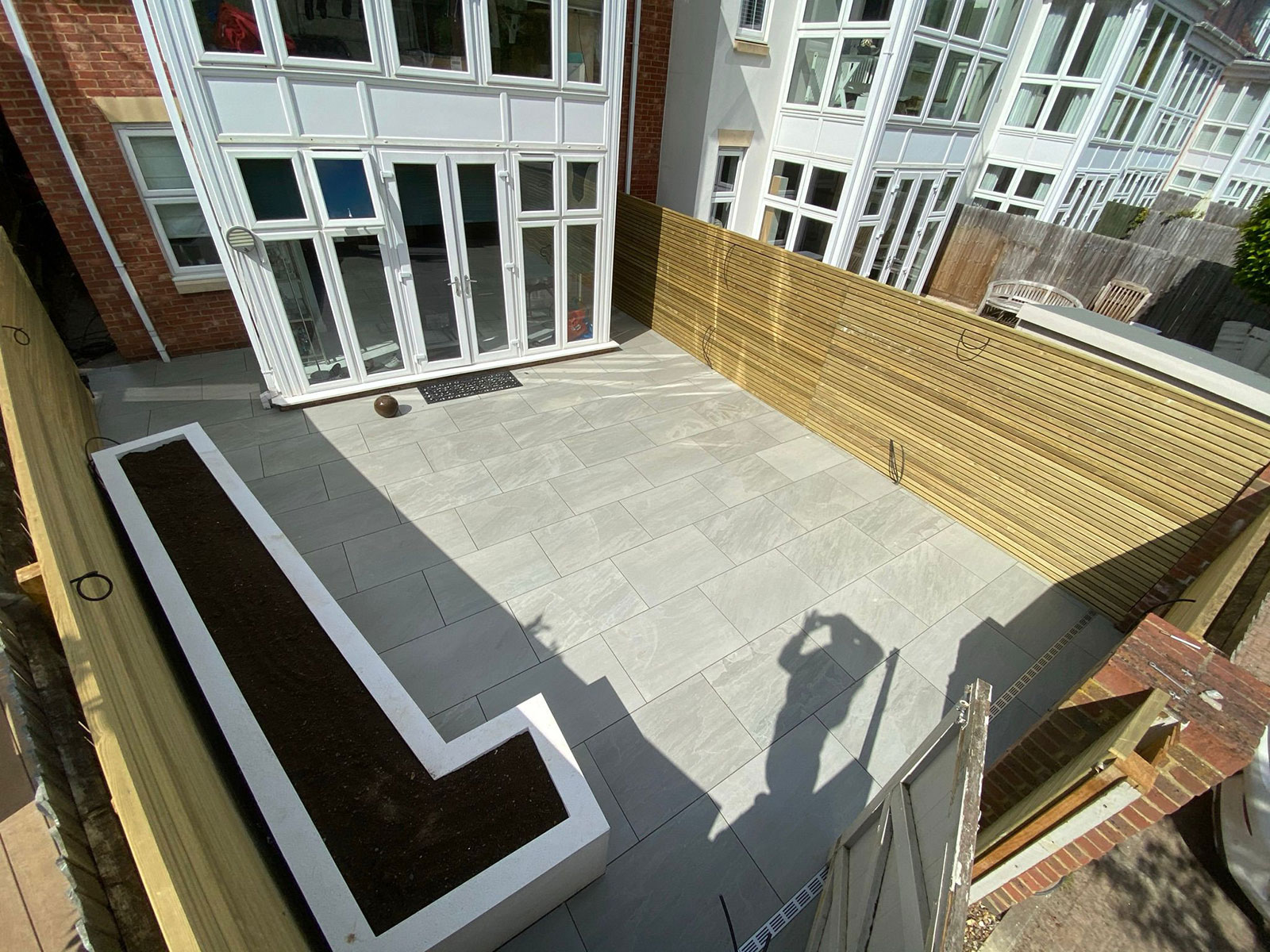 Porcelain patio by Stone Landscapes, Woking, Surrey