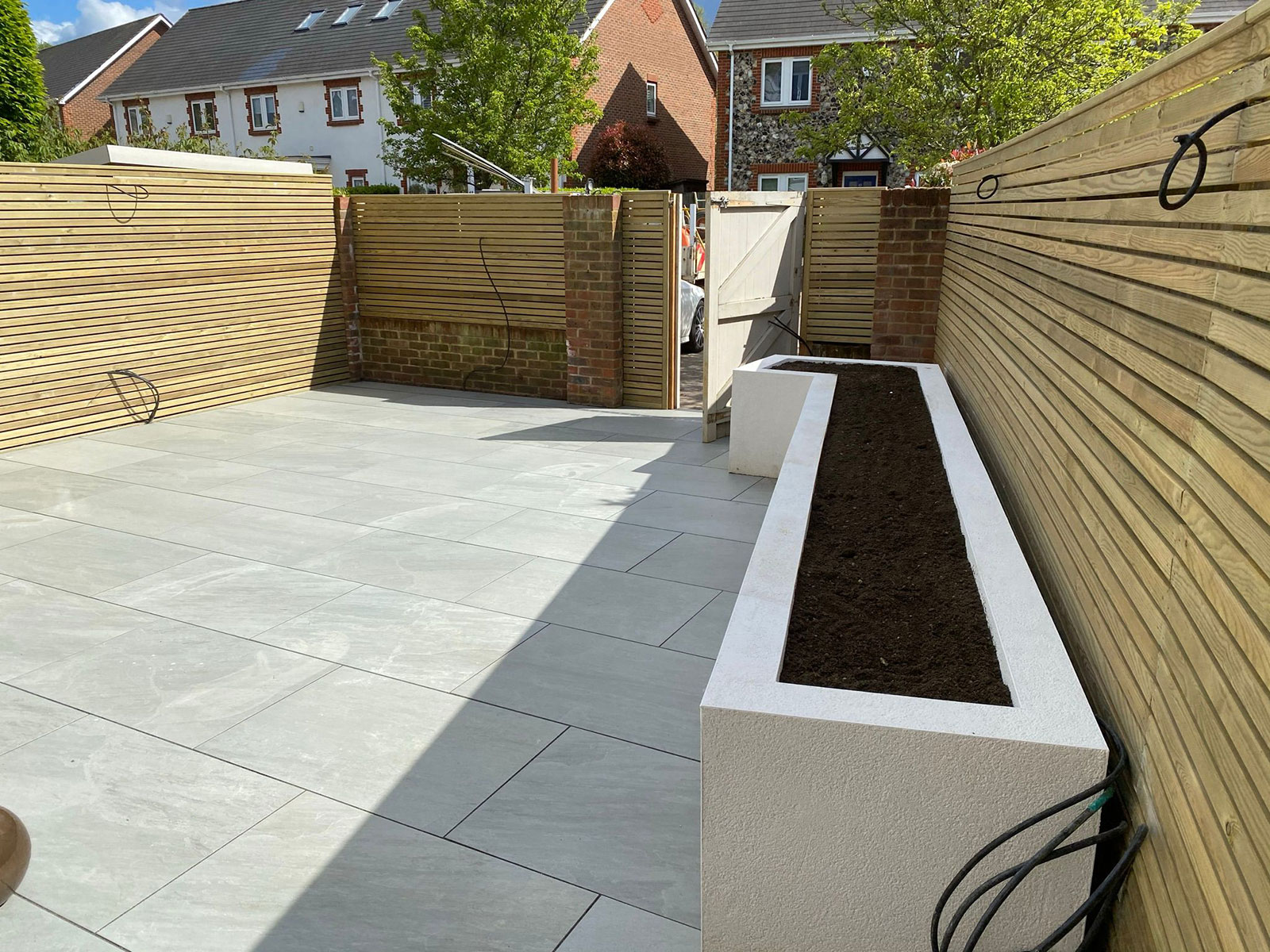 Porcelain patio by Stone Landscapes, Woking, Surrey
